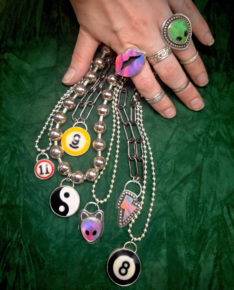 small and large billard ball necklaces to show size context. ball chain