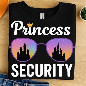 May include: Black t-shirt with the words "Princess Security" in white, a gold crown, and sunglasses with a castle scene. The sunglasses have purple frames and lenses with a sunset and castle design.