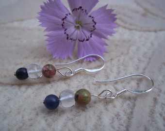 May include: A pair of silver earrings with three beads each. The beads are blue, clear, and a mottled green and brown color.
