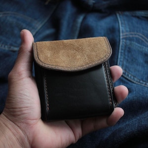 Cartera de cuero genuino: hecha a mano, duradera y elegante.