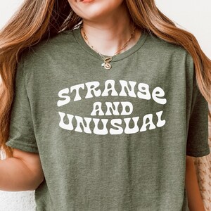 Strange and Unusual Shirt | Vintage Gothic Rock Tee | 70s Retro Goth Shirt | Weird Graphic Tee for Women