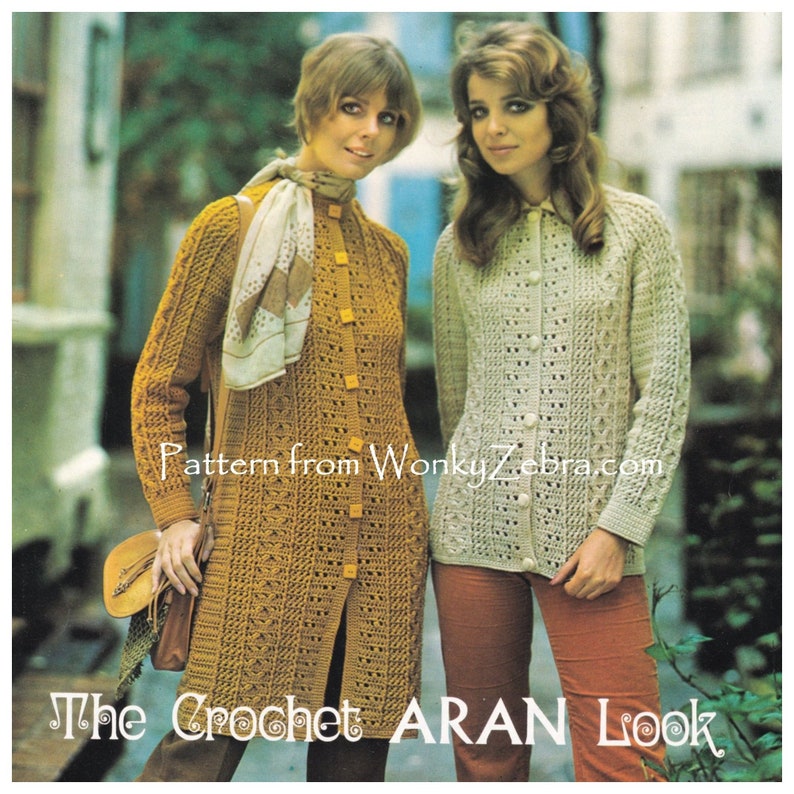 May include: Two women wearing crocheted cardigans. The cardigan on the left is a long, mustard yellow cardigan with a button closure. The cardigan on the right is a shorter, cream-colored cardigan with a button closure. The text "Pattern from WonkyZebra.com" and "The Crochet ARAN Look" is visible at the bottom of the image.