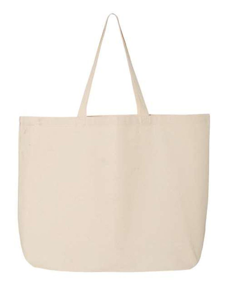 May include: A large, cream-colored tote bag with long handles. The bag is rectangular with rounded corners and a simple, minimalist design. The handles are made of the same material as the bag and are attached at the top.