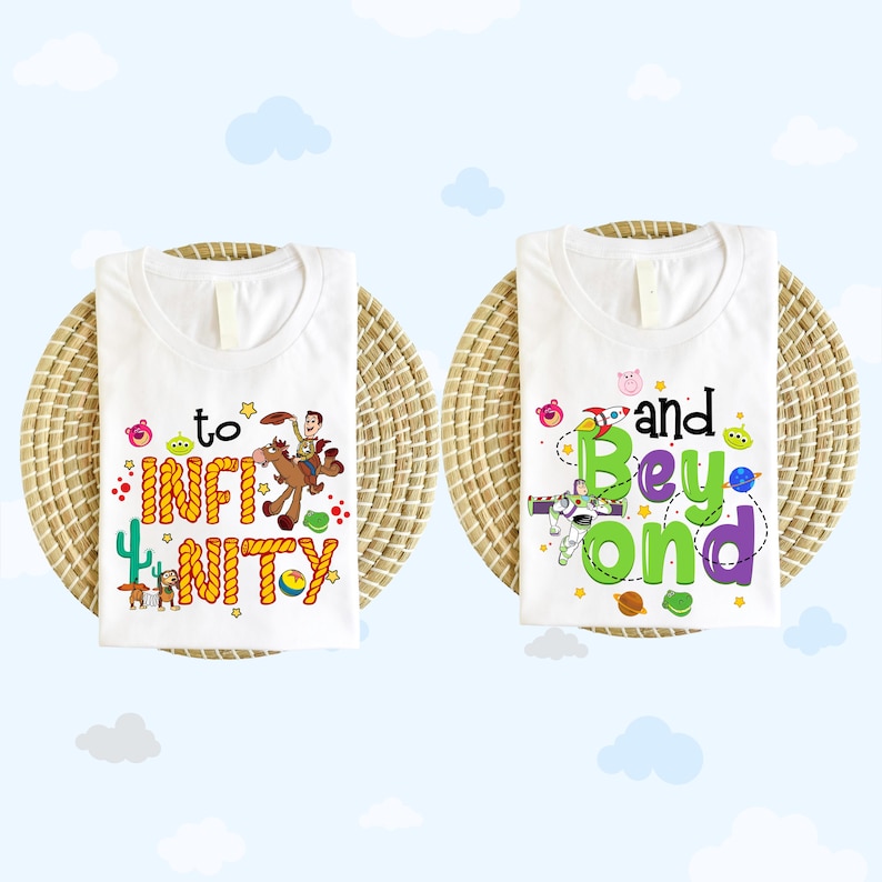 May include: Two white t-shirts with Toy Story themed designs. The first shirt has a yellow rope design that spells out 'to infinity' with a picture of Woody riding Bullseye. The second shirt has a green rope design that spells out 'and beyond' with a picture of Buzz Lightyear in a space suit.