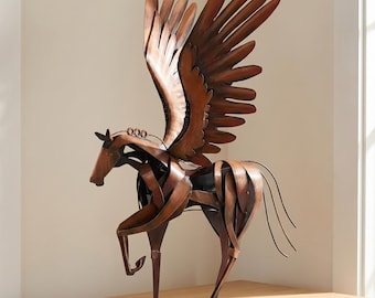 May include: A metallic sculpture of a winged horse, or Pegasus, crafted from curved copper-toned metal strips. The figure features large, upright wings, a slender neck, and a dynamic pose with one front leg raised, all mounted on a flat rectangular base.