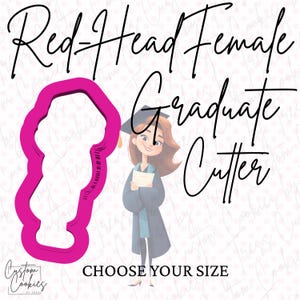 May include: Pink plastic cookie cutter in the shape of a female graduate with red hair. The text "Red-Head Female Graduate Cutter" is written above the cutter. The text "Choose Your Size" is written below the cutter.