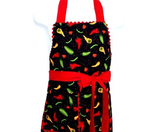 May include: Red and black kitchen apron with a chili pepper print and a red ribbon tie.