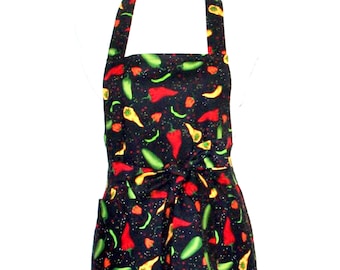 May include: A black apron with a colorful chili pepper print. The apron has adjustable straps and a tie at the waist. It also has two pockets on the front.