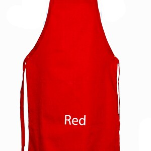 May include: A solid red apron with adjustable straps. The apron has the word "Red" printed on the front.