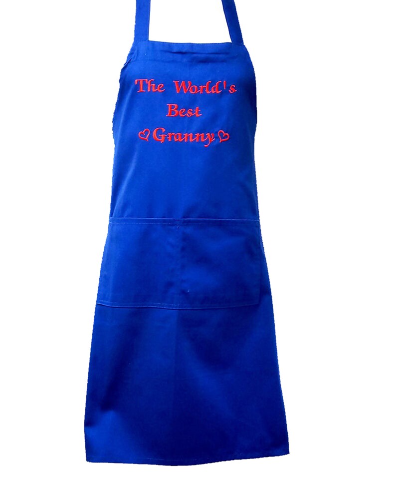 May include: A blue apron with a red embroidered message that reads "The World's Best Granny" with two hearts.