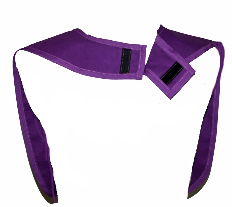 May include: Purple fabric neck wrap with two adjustable straps and velcro closures.