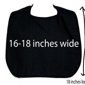 May include: A solid black bib, approximately 16-18 inches wide and 18 inches long. The bib has a curved bottom edge and a rounded neckline. The text "16-18 inches wide" is displayed on the bib.