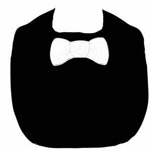May include: A black bib with a white bow tie design.