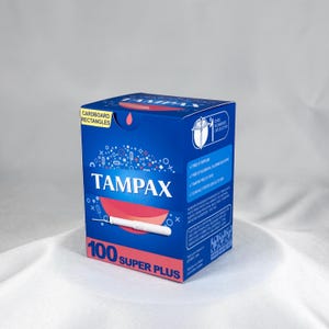 May include: A blue rectangular cardboard box of Tampax Super Plus tampons. The front features the brand name in white, a graphic of a white tampon, and the text 100 SUPER PLUS. A yellow tab reads CARDBOARD RECTANGLES. Side text lists product features.