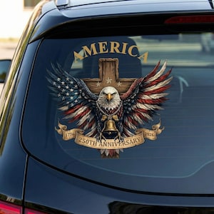 May include: A car window sticker depicting an American bald eagle with wings spread, the American flag, and a wooden cross. The text "AMERICA" and "250TH ANNIVERSARY 1776-2026" are also included.