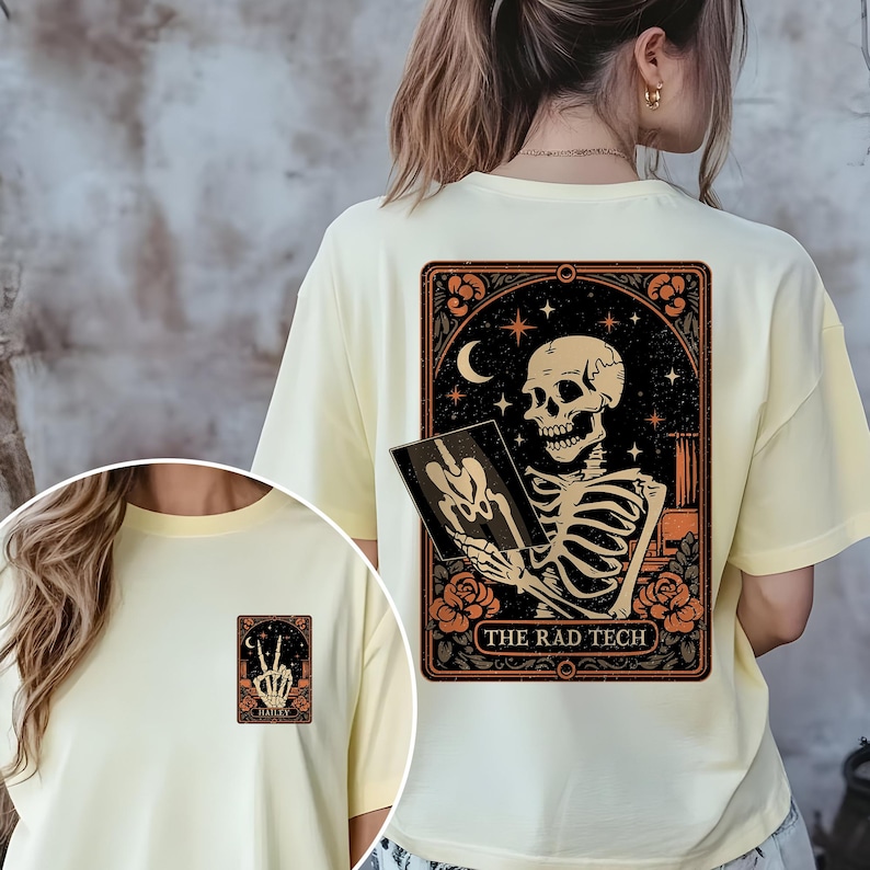 Back design of the Halloween rad tech shirt displaying a detailed skeleton doing an X-ray gesture surrounded by moon and floral motifs. Printed on a burnt orange tee, this makes a stylish and festive gift for radiology or imaging professionals.