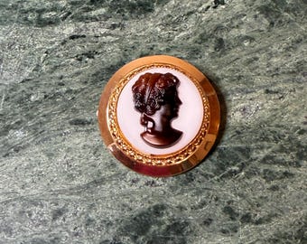 Vintage Gold-Tone Cameo Brooch of an Amber Profile on White Background