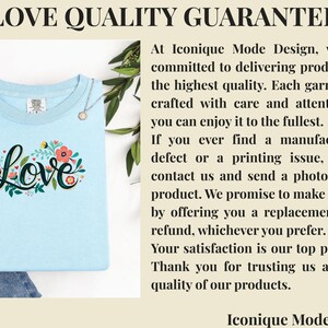 May include: A light blue t-shirt featuring a central graphic of the word Love in black script, surrounded by colorful floral illustrations in red, orange, and green. The text Love Quality Guarantee and a policy statement from Iconique Mode Design are visible.