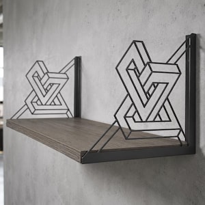 May include: A wall-mounted shelf featuring a dark brown wood-grain plank supported by two black metal brackets. Each bracket displays a geometric, three-dimensional wireframe design consisting of interconnected angular lines and rectangular shapes.