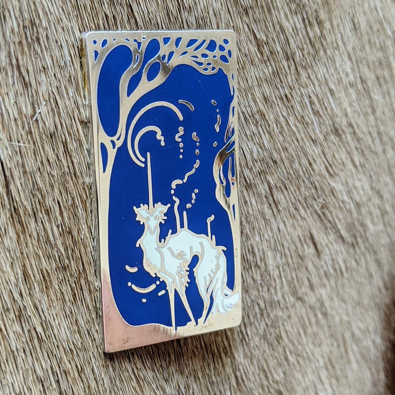 polished silver-finished nickel metal filled with a gorgeous blue and white enamel silken windhound pin The Littlest Unicorn