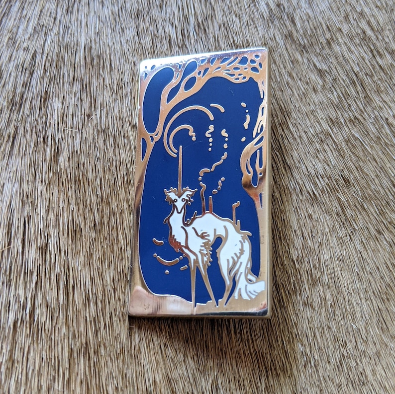 polished silver-finished nickel metal filled with a gorgeous blue and white enamel silken windhound pin The Littlest Unicorn