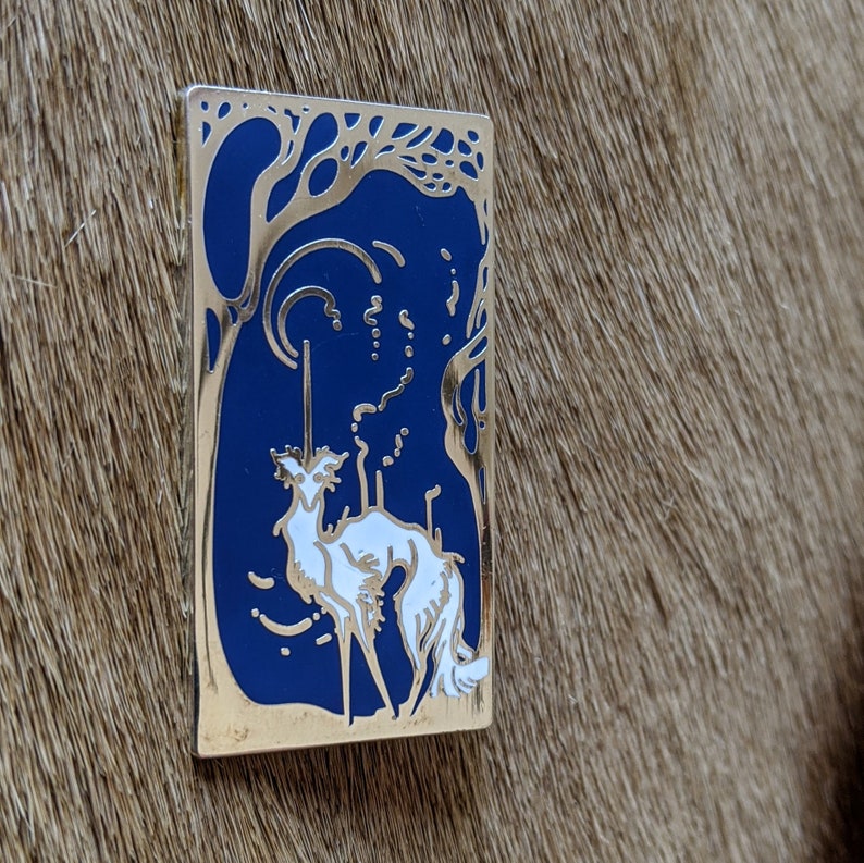 polished silver-finished nickel metal filled with a gorgeous blue and white enamel silken windhound pin The Littlest Unicorn
