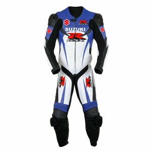 May include: A blue, white, and black Suzuki GSX motorcycle racing suit. The suit features the Suzuki logo and GSX branding in red and white. The suit has black leather padding on the knees and shoulders.