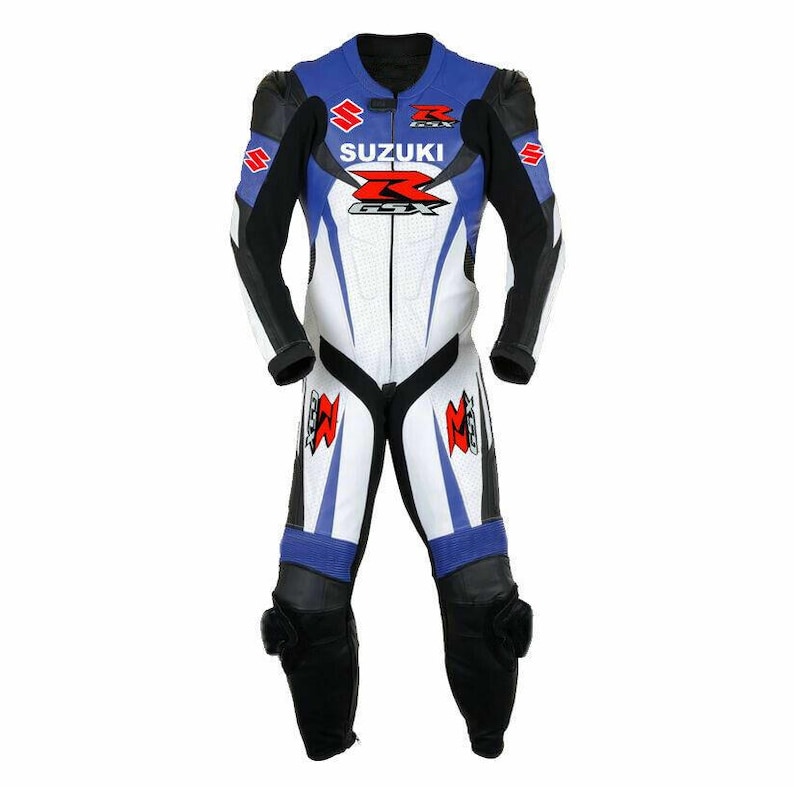 May include: A blue, white, and black Suzuki GSX motorcycle racing suit. The suit features the Suzuki logo and GSX branding in red and white. The suit has black leather padding on the knees and shoulders.