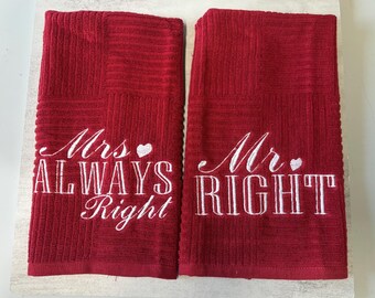 May include: Two deep red kitchen towels with a textured waffle weave pattern. The left towel features white embroidered text that reads Mrs. ALWAYS Right with a small heart. The right towel features white embroidered text that reads Mr. RIGHT with a heart.