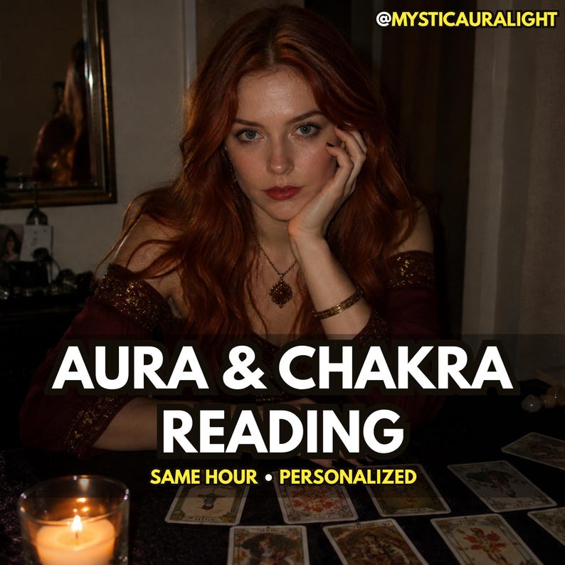 May include: A person with long auburn hair wearing a dark red off-the-shoulder top with gold trim, a gold necklace, and a gold bracelet. Text reads: @MYSTICAURALIGHT AURA & CHAKRA READING SAME HOUR &bull; PERSONALIZED. Tarot cards and a lit candle are visible.