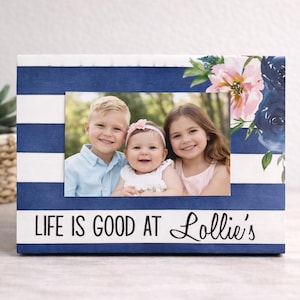 May include: A rustic wooden sign with the text "Welcome to our home" in white lettering. The sign features a distressed finish and a simple, inviting design, perfect for a front porch or entryway.