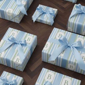 Gift Wrapping Paper Custom Monogram Personalized Design Baby Shower Birthday Neutral Gender Blue Stripe Elegant Pattern Coastal Soft Hues Blue Sage Cream Neutral Palette Premium Thick Paper High Definition Print Fine Art Quality