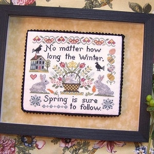 Peut inclure: Une broderie au point de croix encadrée avec un motif floral et le texte "Peu importe la longueur de l'hiver, le printemps est sûr de suivre."