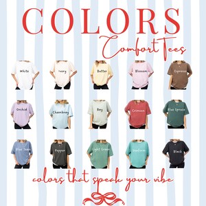 May include: A promotional image showcasing a variety of Comfort Tees in various colors, including White, Ivory, Butter, Blossom, Espresso, Orchid, Chambray, Bay, Crimson, Blue Spruce, Blue Jean, Pepper, Light Green, Seaform, and Black. The text "COLORS Comfort Tees" is displayed at the top, with "colors that speak your vibe" at the bottom.