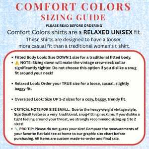 May include: A Comfort Colors sizing guide with a light blue background and red text. It explains the relaxed unisex fit, offering advice on sizing down for a fitted look, ordering true size for a relaxed fit, or sizing up for an oversized look.