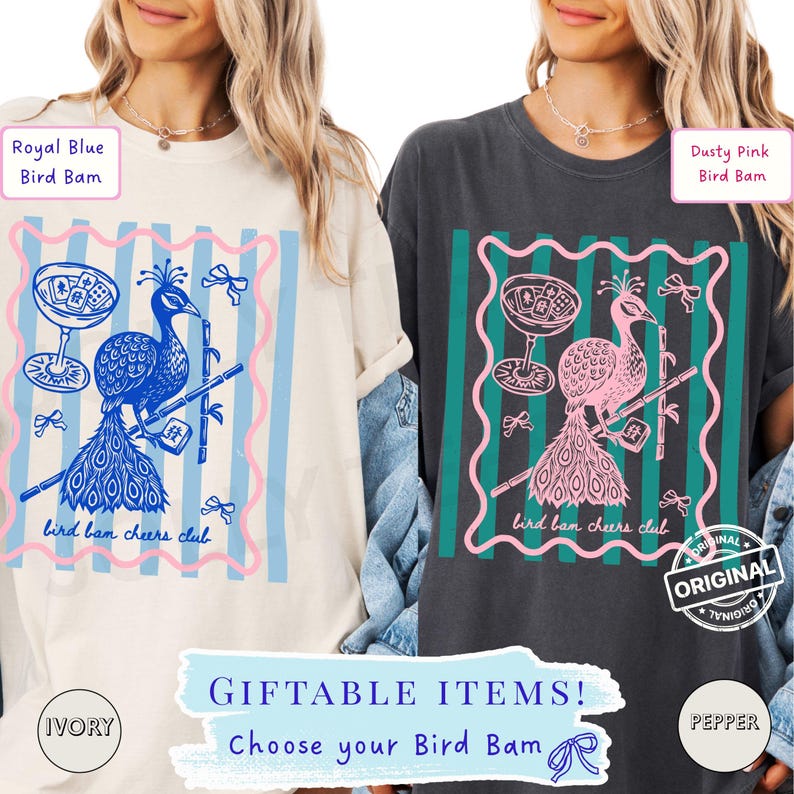 May include: Two t-shirts, one ivory and one pepper, featuring a peacock design with the text "bird bam cheers club." The design includes a cocktail glass and bamboo. The text "GIFTABLE ITEMS! Choose your Bird Bam" is also present.