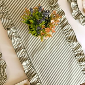 Close-up of ruffled table runner showing premium linen texture and handcrafted striped pattern, machine washable for easy care.
