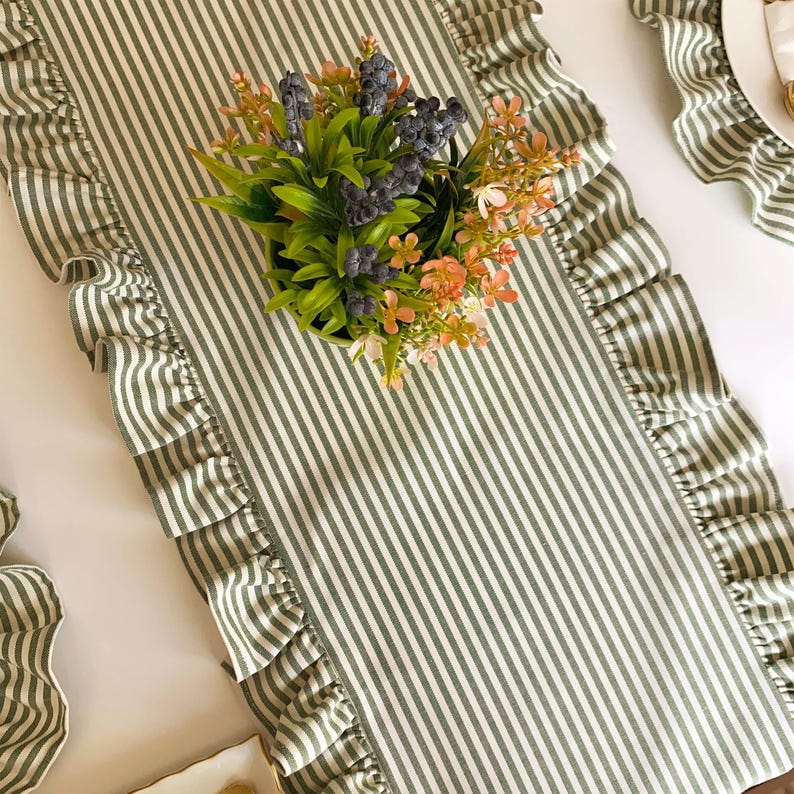 Close-up of ruffled table runner showing premium linen texture and handcrafted striped pattern, machine washable for easy care.