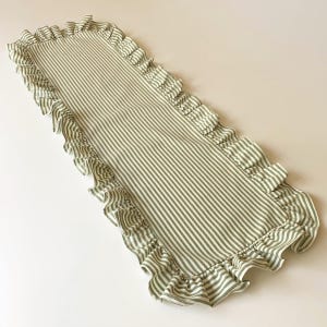 Multiple green table runners with coordinating placemats, versatile spring table linens for entertaining and everyday dining.