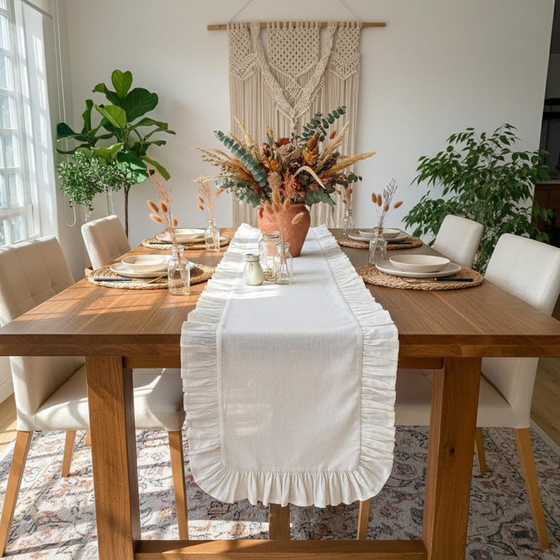 Boho modern table runner styling, macrame wall art complements farmhouse dining room aesthetic