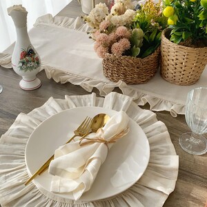 Custom placemats complete table setting with gold cutlery and flowers, washable linen fabric for fall dining and special occasions
