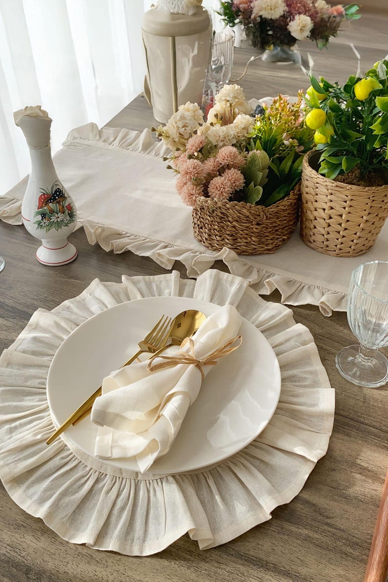 Custom placemats complete table setting with gold cutlery and flowers, washable linen fabric for fall dining and special occasions
