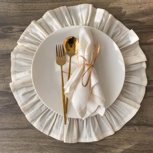 Overhead view of round placemat displaying full ruffled edge design, organic materials create elegant dining experience for any table