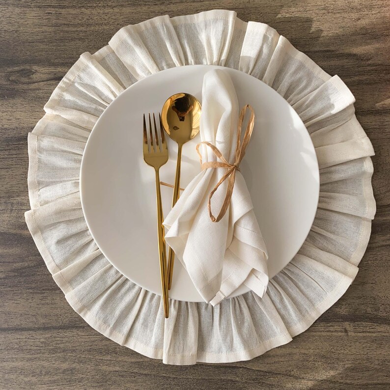 Overhead view of round placemat displaying full ruffled edge design, organic materials create elegant dining experience for any table