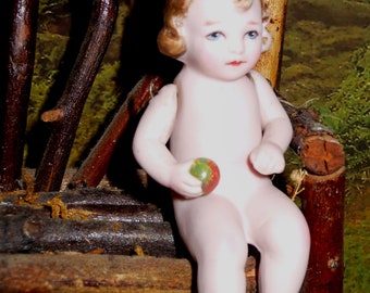 Antique Mibs type pink bisque baby with hair bow and holding ball rare sitting stance