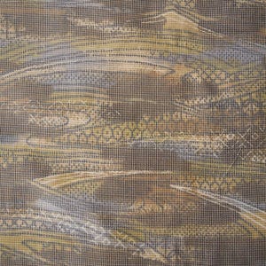 May include: Close-up of a textured fabric with a landscape design. The fabric features a blend of brown, tan, and olive green hues, with subtle blue and white accents. The pattern resembles a stylized depiction of mountains and water.