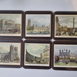 May include: Set of six square coasters featuring vintage illustrations of London landmarks. Each coaster has a dark brown border and depicts scenes such as The Houses of Parliament and The Tower of London. The coasters are likely made of a durable material.