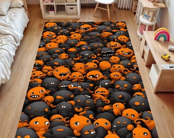Tapis décoratif à motifs de monstres, orange et noir, idéal pour chambre ou salle de jeux d'enfant.