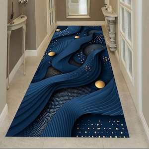 May include: A navy blue hallway runner rug with a 3D wave design. The rug features gold circular accents and a dotted pattern. The design creates a sense of depth and movement, adding a modern touch to the hallway.