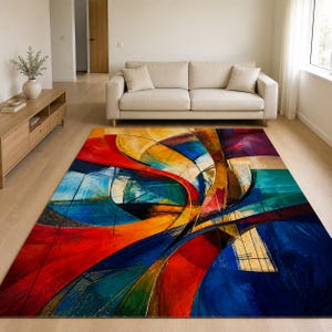 May include: A rectangular area rug featuring a vibrant abstract design with sweeping curves and bold blocks of colour including deep blue, bright red, golden yellow, and teal. The pattern consists of layered shapes and intersecting lines.